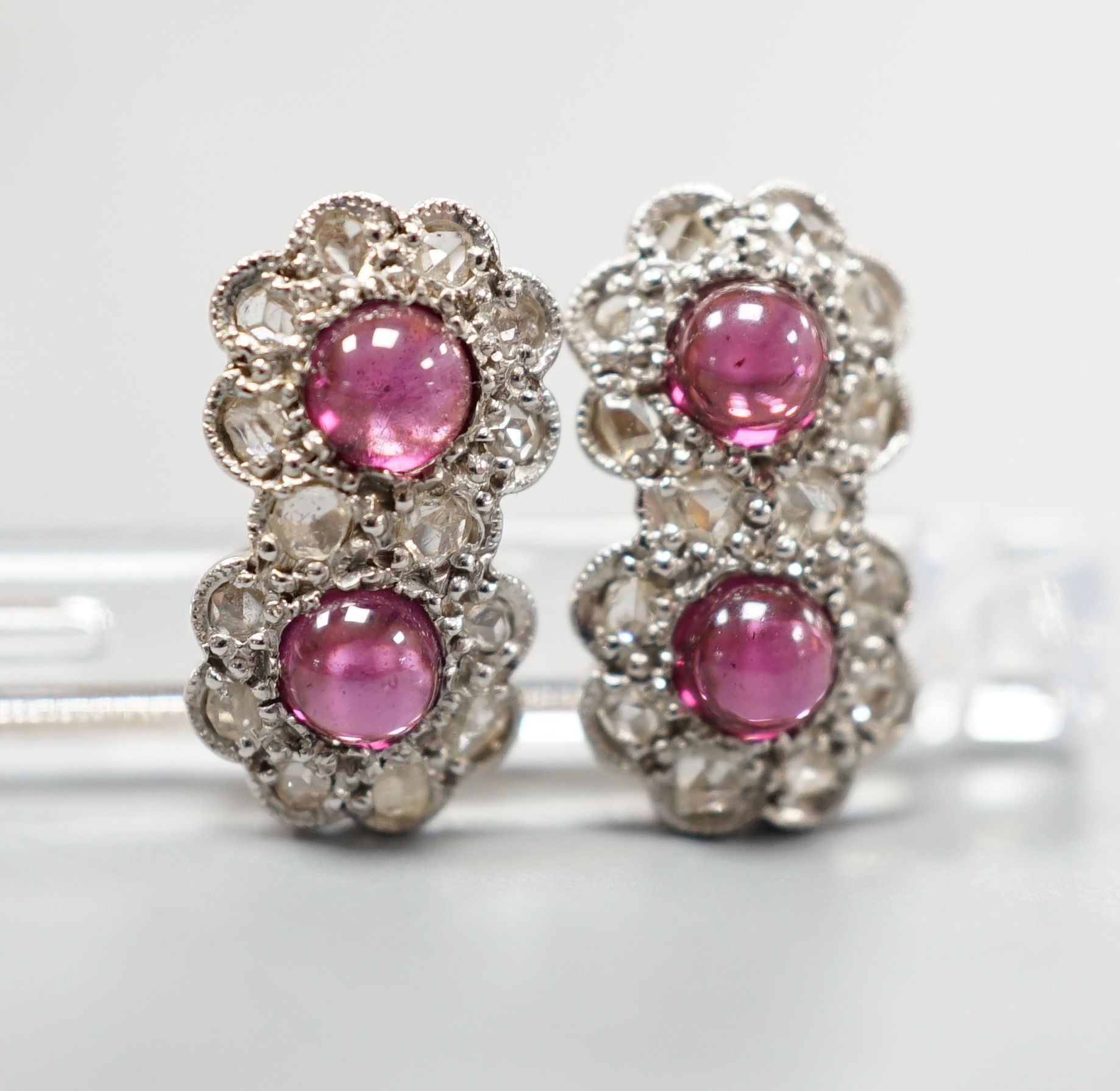 A pair of cabochon garnet and diamond set double cluster earrings (lacking butterflies), 14mm, gross weight 2.5 grams.